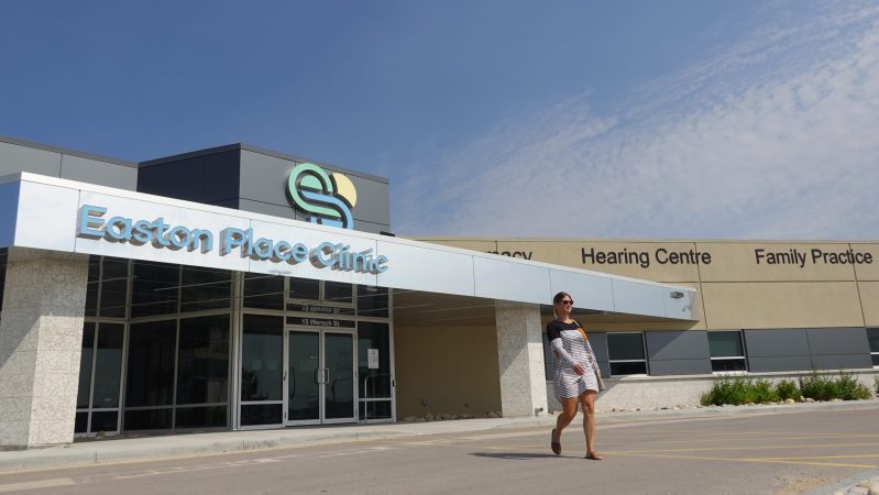 woman leaving the Easton Place Clinic in summer