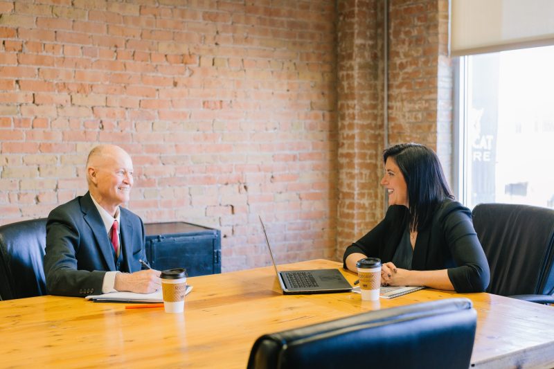 man and woman in a meeting