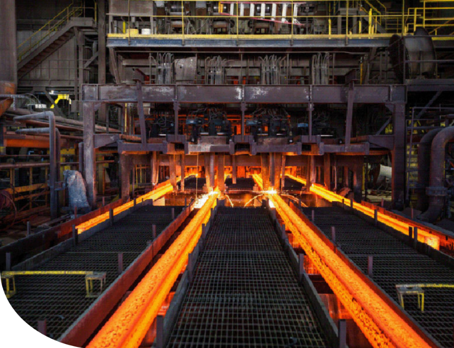 Gerdau steel facility showing a dark room with hot orange steel and sparks.
