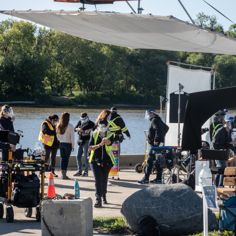 film crew setting up along the water front